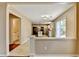 View of the eat-in kitchen which features tile floors, white cabinets, and stainless appliances at 12060 Carriage Park Ln, Duluth, GA 30097