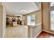 Spacious eat-in kitchen features tile floors, white cabinets, and a sliding door to the patio at 12060 Carriage Park Ln, Duluth, GA 30097