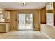 View of the kitchen eat-in area with sliding glass doors leading to the backyard at 12060 Carriage Park Ln, Duluth, GA 30097
