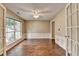 Bright living room with hardwood floors, large windows, and elegant wainscoting at 12060 Carriage Park Ln, Duluth, GA 30097