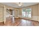 Living room boasts hardwood floors, ample natural light, and glass panel doors at 12060 Carriage Park Ln, Duluth, GA 30097