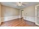 Cozy room featuring hardwood floors and elegant wainscoting for a refined and welcoming atmosphere at 12060 Carriage Park Ln, Duluth, GA 30097