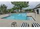 Community pool with lounge chairs and clear, inviting water at 12060 Carriage Park Ln, Duluth, GA 30097