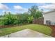 Back yard with grass and a dark metal fence at 218 Ellis Ln, Woodstock, GA 30189