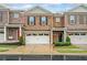 Charming townhome with a one car garage and manicured front lawn at 218 Ellis Ln, Woodstock, GA 30189