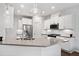 Modern kitchen with white cabinets, stainless steel appliances, granite countertops, and pendant lighting at 218 Ellis Ln, Woodstock, GA 30189
