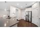 Modern kitchen featuring stainless steel appliances, white cabinets, and ample counter space at 218 Ellis Ln, Woodstock, GA 30189