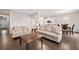 Spacious open-concept living area with hardwood floors seamlessly connecting to the kitchen and dining at 218 Ellis Ln, Woodstock, GA 30189