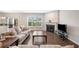 Cozy living room with a fireplace, hardwood floors, and large windows for natural light at 218 Ellis Ln, Woodstock, GA 30189