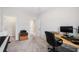 Home office area featuring a desk, keyboard, printer, and doorway to a walk-in closet at 218 Ellis Ln, Woodstock, GA 30189