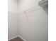 Empty walk-in closet with metal shelving and carpeted floors offers ample storage space at 218 Ellis Ln, Woodstock, GA 30189
