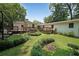 This backyard features multiple outdoor decks, landscaped garden areas and mature trees at 2394 Burch Ne Cir, Brookhaven, GA 30319