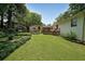 Well-maintained backyard with a lush lawn, established landscaping, and multiple decks at 2394 Burch Ne Cir, Brookhaven, GA 30319