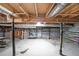 Spacious unfinished basement with concrete block walls, black support columns, and exposed ductwork at 2394 Burch Ne Cir, Brookhaven, GA 30319