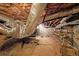 Unfinished basement with exposed pipes, concrete block walls, and shelving, ready to be transformed at 2394 Burch Ne Cir, Brookhaven, GA 30319