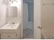 Clean bathroom showcasing a vanity, sink, mirror, and bathtub, featuring tile accents at 2394 Burch Ne Cir, Brookhaven, GA 30319