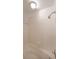 Bathroom features a whirlpool tub, tiled walls, and a showerhead at 2394 Burch Ne Cir, Brookhaven, GA 30319
