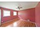 Cozy bedroom features hardwood floors, fresh paint, and natural light from two windows at 2394 Burch Ne Cir, Brookhaven, GA 30319