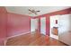 Cozy bedroom featuring hardwood floors, fresh paint, and doorways to closet and bath at 2394 Burch Ne Cir, Brookhaven, GA 30319