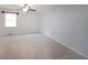 Bright bedroom features neutral carpet, ceiling fan, and natural light from the window for a relaxing atmosphere at 2394 Burch Ne Cir, Brookhaven, GA 30319