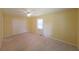 Bedroom with carpet flooring, neutral colored walls, and a double door closet at 2394 Burch Ne Cir, Brookhaven, GA 30319