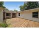 This outdoor deck features space for outdoor entertaining and overlooks the surrounding trees and yard at 2394 Burch Ne Cir, Brookhaven, GA 30319