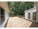 This outdoor deck features an outdoor entrance to the home and overlooks the surrounding trees and yard at 2394 Burch Ne Cir, Brookhaven, GA 30319