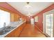 Spacious kitchen featuring wood cabinets, hardwood floors, and modern appliances, perfect for cooking and entertaining at 2394 Burch Ne Cir, Brookhaven, GA 30319