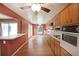 Well-lit kitchen with hardwood floors, long countertops, plenty of cabinetry, and a breakfast bar connecting to the dining area at 2394 Burch Ne Cir, Brookhaven, GA 30319