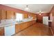 Classic kitchen design with light wood cabinetry, white countertops, and essential appliances for functionality at 2394 Burch Ne Cir, Brookhaven, GA 30319