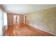 Open living space featuring gleaming hardwood floors, neutral walls, and natural light at 2394 Burch Ne Cir, Brookhaven, GA 30319