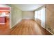 Bright living room with hardwood floors, textured walls, and large window with natural light at 2394 Burch Ne Cir, Brookhaven, GA 30319