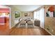 Bright living room with hardwood floors, textured walls, furniture, and large window at 2394 Burch Ne Cir, Brookhaven, GA 30319