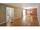 Open living room with hardwood floors connects to dining area and kitchen, creating a spacious and inviting atmosphere at 2394 Burch Ne Cir, Brookhaven, GA 30319