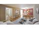 Staged living room with hardwood floors offering an open layout connecting to dining and kitchen areas, great for entertaining at 2394 Burch Ne Cir, Brookhaven, GA 30319