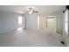 Expansive main bedroom with a ceiling fan, carpet, and a walk-in closet with doors at 2394 Burch Ne Cir, Brookhaven, GA 30319