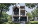 Stunning three-story home featuring a modern design, multiple balconies, and professional landscaping at 339 Peachtree Ne Ave, Atlanta, GA 30305