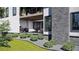 Inviting patio with stone detail, outdoor seating, and lush landscaping for relaxing and entertaining at 339 Peachtree Ne Ave, Atlanta, GA 30305