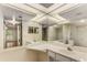 The bathroom has double sinks with large mirrors, tile floors, and a shower at 408 Coleraine Se, Smyrna, GA 30080