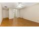 Spacious bedroom featuring hardwood floors, a ceiling fan, and ensuite bathroom at 408 Coleraine Se, Smyrna, GA 30080