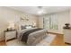 Serene main bedroom with hardwood floors, shuttered windows, and a ceiling fan for added comfort at 408 Coleraine Se, Smyrna, GA 30080