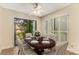 Dining area with sliding door access to balcony and modern ceiling fan at 408 Coleraine Se, Smyrna, GA 30080