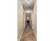 Inviting hallway with tiled floors and doors leading to various rooms, including one with a fireplace at 408 Coleraine Se, Smyrna, GA 30080