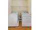 Brightly lit laundry area with washer and dryer, as well as above rack at 408 Coleraine Se, Smyrna, GA 30080