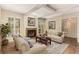 Cozy living room with fireplace, plush seating, and plantation shutters at 408 Coleraine Se, Smyrna, GA 30080