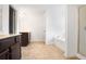 A spacious bathroom featuring a double vanity, shower, and a soaking tub at 2528 Morgan Chase Dr, Buford, GA 30519