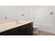 A well-lit bathroom features a modern sink vanity and a shower-tub combo at 2528 Morgan Chase Dr, Buford, GA 30519