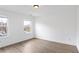 Bright bedroom featuring beautiful flooring and two windows allowing for ample natural light at 2528 Morgan Chase Dr, Buford, GA 30519