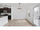Dining room with new floors, modern lighting, and access to the backyard at 2528 Morgan Chase Dr, Buford, GA 30519