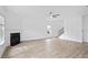 Spacious living room with a fireplace, new floors, and modern decor at 2528 Morgan Chase Dr, Buford, GA 30519